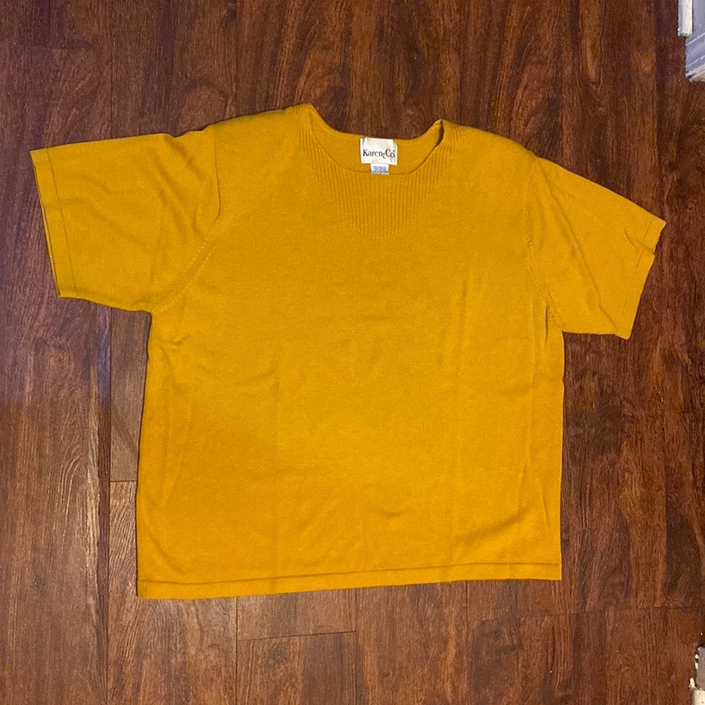 Woman’s gold Sweater